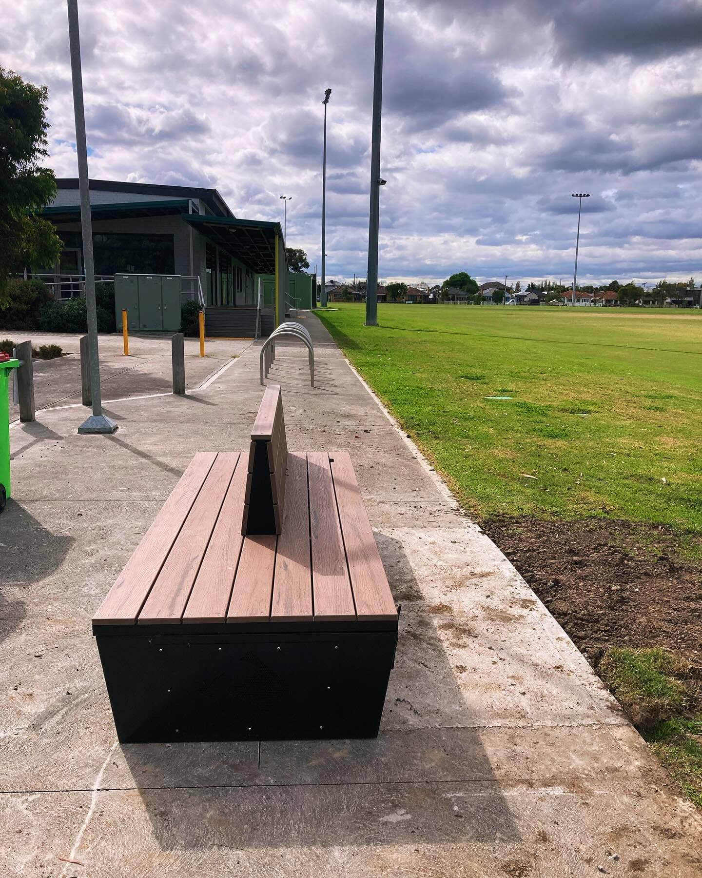 Completed bench seat valve enclosure overlooking the sports field at Angliss Reserve